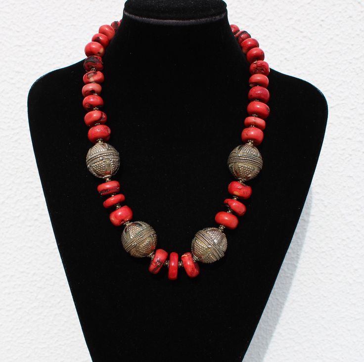 A beautiful tribal gilt silver & geniune coral beaded necklace. Length: 50 cm / 19.6 inches. Silver beads are 2.3 cm / 0.9 inches in diameter Weight: 118 grams. Marked: 925 for silver. OK vintage condition, some coral pearls have damages / chips as shown in the pictures. Standard free (uninsured) registered shipping with tracking number is sent with the postal services ctt.pt. Please pay attention to the fact that I'm offering old, used objects meaning that they all are expected to have use / ag Artisan Red Coral Necklace With Large Beads, Spiritual Red Coral Necklace With Polished Beads, Artisan Hand-strung Red Coral Necklace, Gold Necklace With Large Red Coral Beads, Spiritual Red Coral Necklaces With Large Beads, Spiritual Red Coral Necklace With Large Beads, Traditional Red Coral Round Bead Jewelry, Unique Red Coral Necklace With Large Beads, Traditional Red Coral Jewelry With Polished Beads