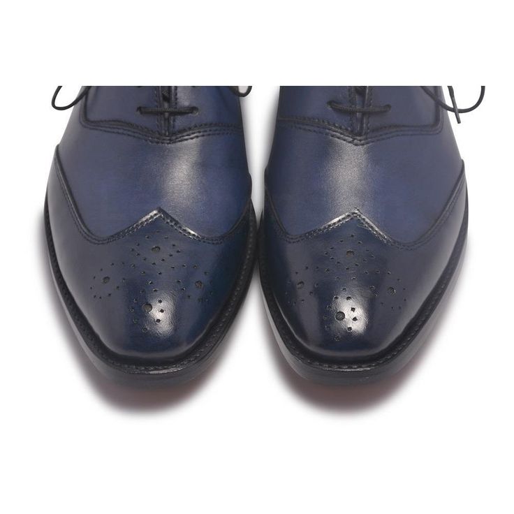 This is the classic two-tone oxford leather shoe in blue - a timeless design in complete classic style featuring genuine leather. The sleek polished quarters and the definitive design make this one a gentleman’s choice. Moreover, the simple yet smart design of this shoe is what makes the footwear so absolutely popular among men. The unique features are: High-quality genuine leather shoes Comfortable insole Decorative perforations along the toe line with closed laces Two Tone design Style it with a tailored suit with matching socks or pair them dark blue or black jeans on a casual night out. Fantastic quality at an unbelievable price - this one is a real winner. Its a shoe you’ll absolutely love to show off. Blue Wingtip Monk Strap Business Shoes, Blue Wingtip Monk Strap Shoes For Business, Blue Monk Strap Shoes With Brogue Detailing For Business, Blue Plain Toe Oxfords For Business, Blue Wingtip Dress Shoes With Brogue Detailing, Blue Monk Strap Shoes With Leather Sole, Classic Blue Wingtip Oxfords, Blue Brogue Dress Shoes, Classic Blue Oxfords With Brogue Detailing