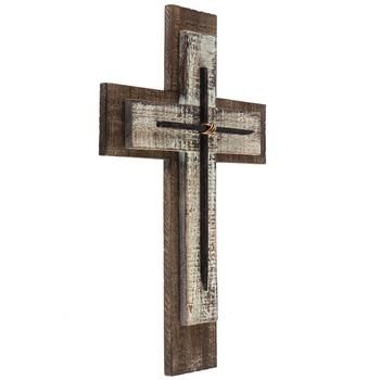 a wooden cross hanging on the wall