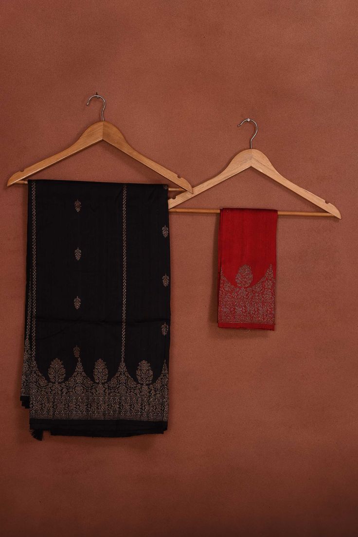 Radiate elegance on festive occasions in this stunning black tussar Banarasi saree with antique zari work. It comes with a red blouse piece. Disclaimer: The shown stitched blouse on the model is for display purpose only. The saree comes with a matching blouse piece and finished with fall and piko. Disclaimer: The actual product may vary slightly from the image. These are custom orders, hence expect slight variation in color, placement of the motif or buta. ESTIMATED DELIVERYBecause this is a cus Silk Sarees Kanchipuram, Banarasi Sari, Tussar Silk Sarees, Indian Clothing Store, Latest Designer Sarees, Fashion Journals, Bangle Ring, Red Blouse, Tussar Silk Saree