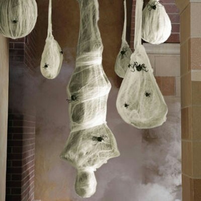 some meat hanging from the ceiling in a kitchen with steam coming out of them and on top of it