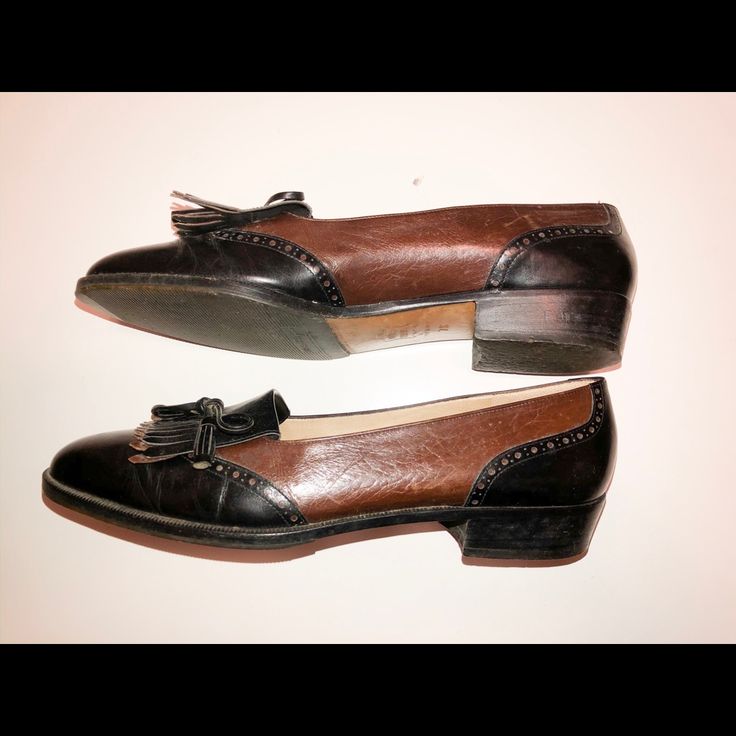 Classic Women’s Black And Brown Ferragamo Shoes Brown Calf Leather Tassel Loafers With Round Toe, Black Calf Leather Tassel Loafers For Galas, Black Calf Leather Tassel Loafers For Work, Designer Black Leather Tassel Loafers, Black Calf Leather Tassel Loafers With Rubber Sole, Black Leather Tassel Loafers With Almond Toe, Black Tassel Loafers With Rubber Sole In Calf Leather, Black Leather Wingtip Tassel Loafers, Black Wingtip Tassel Loafers With Rubber Sole