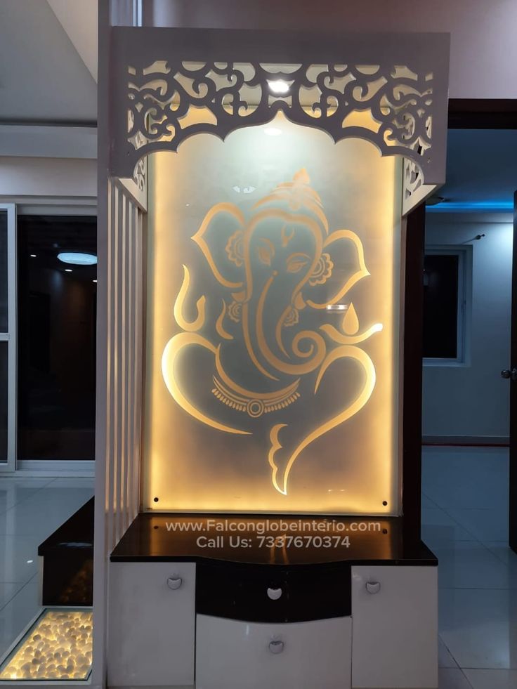 an illuminated gandap in the middle of a room with white walls and flooring