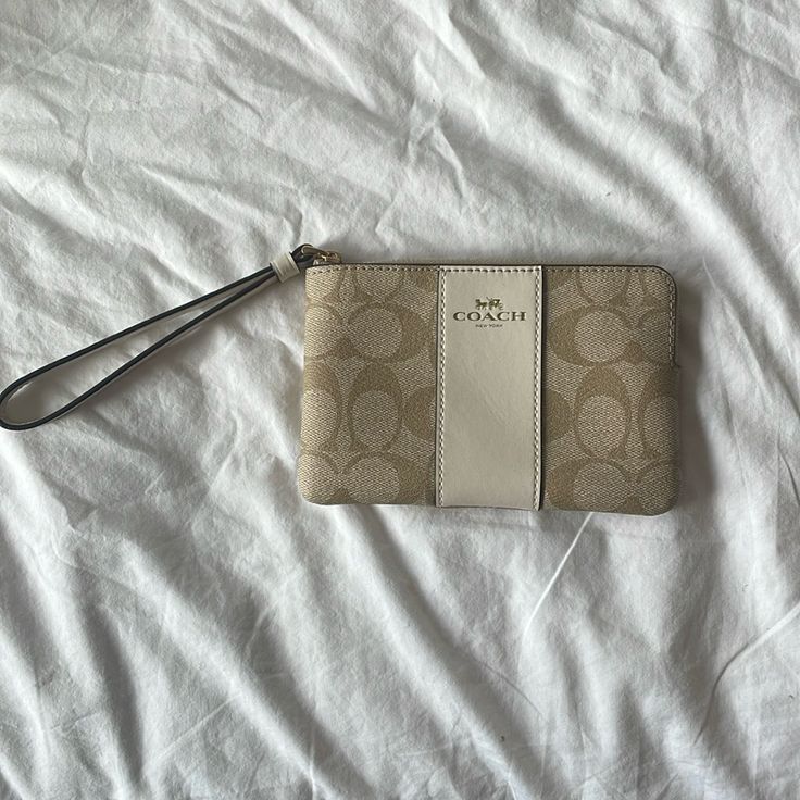 Tan Coach Wristlet With Inside Card Wallet Holder. New With Tags Inside. Never Used. Beige Pouch Wallet For Everyday, Beige Clutch With Wrist Strap For Gift, Beige Clutch With Wrist Strap As Gift, Chic Beige Wallet With Zipper Pouch, Beige Rectangular Clutch With Wrist Strap, Chic Beige Bags With Wrist Strap, Coach Beige Pouch Wristlet, Beige Coach Pouch Wristlet, Cream Pouch Wallet For Everyday Use