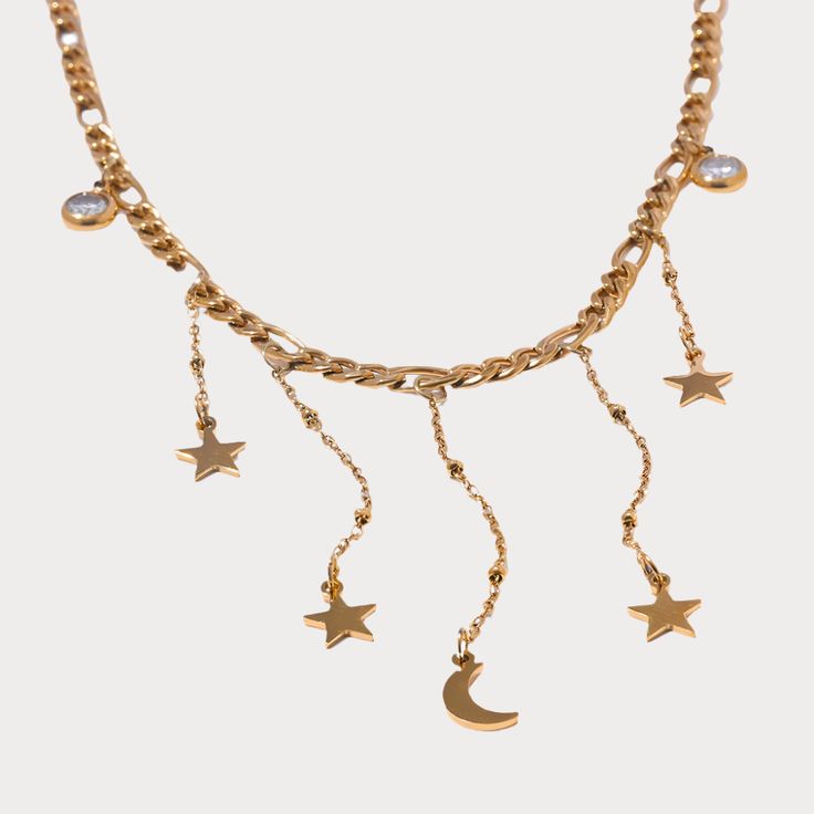 Gold celestial charm necklace with dangling moon and star pendants