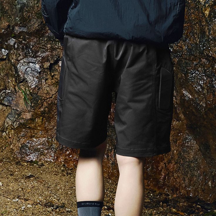 The Deconstructed Sponge Shield Shorts embody the perfect fusion of avant-garde design and superior craftsmanship. These shorts feature a concealed pocket on the front left side, adding a unique and functional element to the design. Constructed from premium fabric, they offer a comfortable and slightly oversized fit, making them a standout piece in any modern wardrobe. Deconstructed design Concealed pocket on front left side Premium fabric Slightly oversized fit Composition: 100% Polyester Brand Utility Bermuda Bottoms With Built-in Shorts, Utility Bermuda Shorts With Built-in Shorts, Outdoor Bottoms With Built-in Shorts, Techwear Bottoms For Outdoor, Functional Shorts With Pockets, Urban Outdoor Shorts With Side Pockets, Techwear Cargo Shorts With Multiple Pockets, Urban Shorts With Side Pockets For Outdoor, Urban Style Shorts With Side Pockets For Outdoor