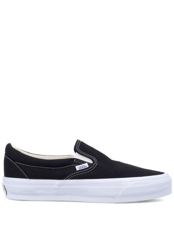 black canvas slip-on style contrast stitching round toe flat rubber sole We've partnered with Good On You — an independent agency that rates how brands perform in relation to their impact on the planet, people and animals, with a multi-criteria rating simplified to a five points scale. In order to be awarded our conscious label, larger brands need to score a minimum of four out of five ('Good'), while smaller brands must score at least three out of five ('It's a start'). This item comes from a brand rated five out of five ('Great') by Good on You at the time it was added on FARFETCH. Please note, this is a brand-level rating and does not guarantee that this product is made with conscious materials. Learn more about what makes a product Conscious on our Conscious Criteria page Casual Black Slip-ons With Contrast Sole, Streetwear Slip-on Sneakers With Rubber Sole, Slip-on Sneakers With Contrast Sole For Streetwear, Slip-on Sneakers With Rubber Sole For Streetwear, Vans Slip-on Sneakers For Streetwear, Slip-on Canvas Shoes With Vulcanized Sole For Streetwear, Vulcanized Sole Slip-on Sneakers For Streetwear, Comfortable Slip-on Skate Shoes With Vulcanized Sole, Vans Slip-on Sneakers With Gum Sole