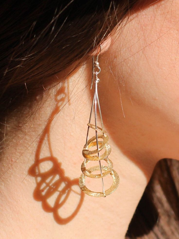 Cornucopia - Prosperity Design - Greek Gold Abstract Perpetual motion Geometric Earrings - Greek Mythology art Jewelry - mythical amulet - by Palsar - Maria Skandalaki Jewelry inspired by "Cornucopia". Cornucopia... also called the horn of plenty, was a symbol of abundance and nourishment, commonly a large horn-shaped container overflowing with produce, flowers, or nuts. In Greek mythology, the horn of goat Amalthea, is the symbol of human prosperity and bliss. The eternal symbol of abundance of Formal Spiral-shaped Jewelry With Matching Earrings, Formal Spiral Jewelry With Matching Earrings, Contemporary Teardrop Jewelry For Pierced Ears, Elegant Spiral Metal Jewelry, Elegant Spiral Sterling Silver Jewelry, Contemporary Teardrop Single Earring, Contemporary Single Teardrop Earring, Contemporary Handmade Teardrop Jewelry, Elegant Dangle Earrings With Unique Design