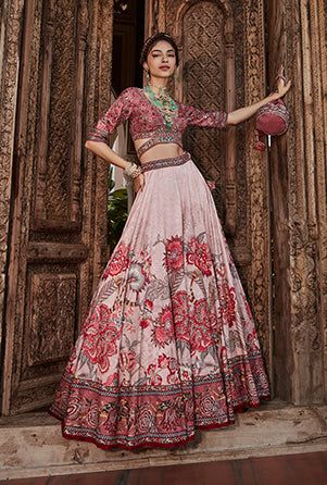 Editor's Note Featuring an elegant interplay of chintz motifs with intricate hand embroidery on the lehenga. It is paired with a meticulously embroidered blouse with intricate thread and hand beadwork on yoke and sleeves and styled with a co-ordinated dupatta. Fabric: Blouse: viscose silk, dupatta: net, lehenga skirt: viscose silk Color: Mauve pink Components: Lehenga, blouse and dupatta Occasion: Festive Disclaimer: Product color may slightly vary due to photographic lighting sources or your mo Traditional Pink Palazzo Set For Reception, Pink Embroidered Palazzo Set For Reception, Pink Anarkali Palazzo Set With Floral Embroidery, Pink Raw Silk Dress With Floral Embroidery, Pink Embroidered Raw Silk Palazzo Set, Pink Raw Silk Palazzo Set For Reception, Pink Raw Silk Set With Floral Embroidery, Pink Silk Sharara With Floral Embroidery, Pink Palazzo Set With Resham Embroidery For Reception