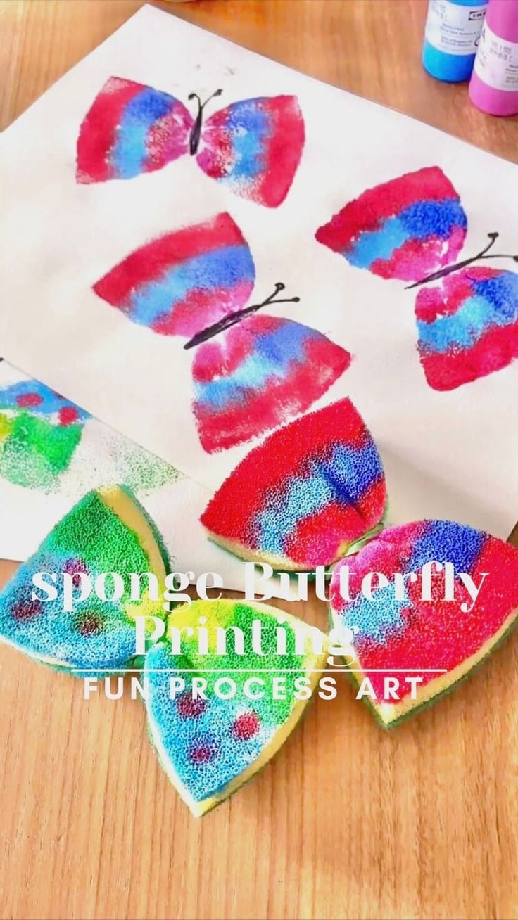 butterfly fingerprint art project for kids to make with colored crayons on paper