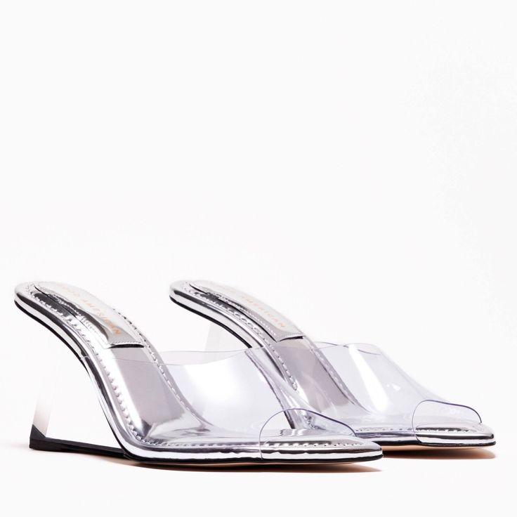 Elevate Your Style With These Stunning Silver Mirror Clear Wedge Sandals From Good American. Perfect For Weddings, Parties, Or Any Occasion, These Strappy Heels Feature A Pointed Toe. The Wedge Heel Measures Approx 3 " There Is Cushion On The Actual Heel Making Them More Comfortable To Wear. Sandals Are Brand New In Box. Dust Bag Included The Box May Show Signs Of Wear From Warehouse Storage But Shoes In Perfectly New Condition. Clear High Heel Wedge Sandals For Spring, Spring High Heel Clear Wedge Sandals, Spring Clear High Heel Wedge Sandals, Modern Wedge Sandals With 4-inch Heel For Summer, Clear Platform Wedge Sandals, Clear Wedge Heel Sandals For Spring, Clear Wedge Heel Shoes For Spring, Chic Clear Wedge Heel Sandals, Clear Wedge Heels For Spring