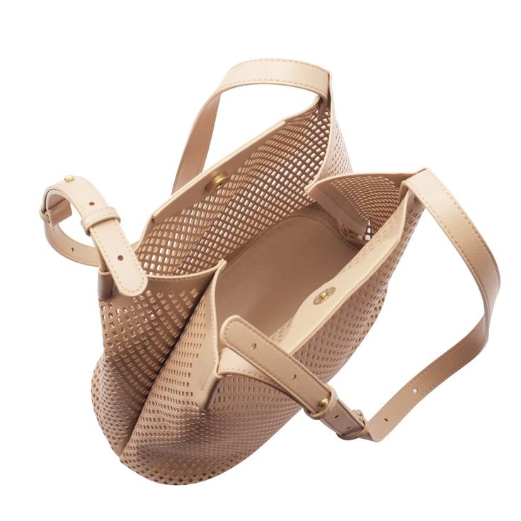 This light and airy handbag are perfect for warmer weather. Unlined Top magnetic button closure Removable interior zip pouch with removable crossbody strap Skinny double shoulder straps Dimensions: L 11" x H 11.5" x D 5" Max. drop handle: 22.5" Min. drop handle: 12.5" Made with 100% vegan leather PETA-Approved Vegan Pilgrim Jewellery, Sneaker Slippers, Best Wallet, Bag Icon, Waist Bags, Work Bags, Zip Pouch, Jewelry Case, Style Gift