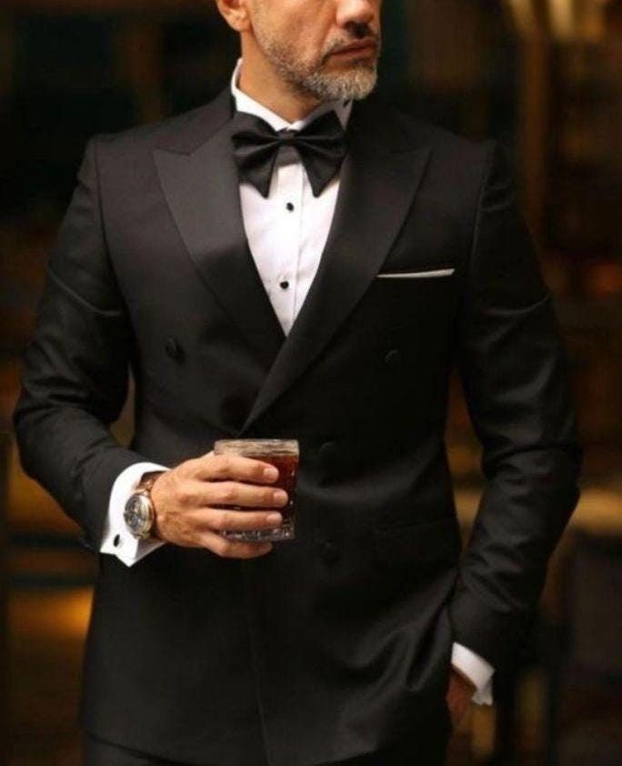 Men Black 2 Piece Tuxedo Suit, Double Breasted suit  Perfect For Wedding, Wedding Groom suits, Bespoke For Men, Best Christmas Gift For Him This is a Two Piece Suit crafted from high quality fabric and imported materials. Our products are handcrafted by experienced tailors who make sure the that the stitching is precise, lining is proper and the overall product is sturdy enough to not go out of shape for more than a few years. Also all our products have extra margins in their length, sleeves, si Black Tie Men’s Attire, Groom Suit Ideas, Suit Double Breasted, Groomsmen Tuxedos, Groom Suits, Double Breasted Tuxedo, Christmas Gift For Him, Wedding Suits Groom, Suit Covers