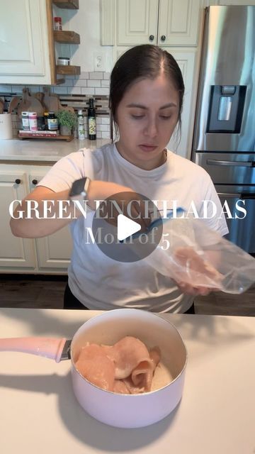 a woman is making some food in a bowl on the kitchen counter with her hands