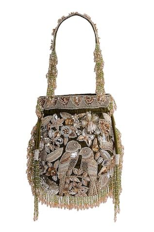 a handbag that is decorated with flowers and beads