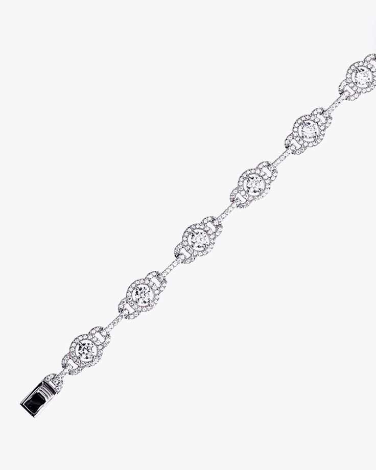 - Halo and Link Bracelet with sterling silver- Made in Sterling silver set with a high-quality Cubic Zirconia. - Stone size: 4.00 mm, 1.10 mm- Length: 7 inch Sterling silver925 Sterling Silver is an alloy made of 92.5% pure silver and 7.5% copper. We plate our silver jewelry in rhodium, which gives it extra shine and durability. Rhodium is one of the costliest precious metals due to its rarity.CareH2O sensitive. Avoid water when wearing your piece, because over time the sterling silver will oxid Silver Fine Jewelry Chain Bracelet With Diamond Accents, Sterling Silver Tennis Bracelet With Diamond Accents, Fine Jewelry Diamond Chain Bracelet In Silver, Fine Jewelry Silver Chain Diamond Bracelet, White Gold Sterling Silver Chain Bracelet With Diamond Accents, Fine Jewelry Silver Diamond Chain Bracelet, Sterling Silver Diamond Cut Tennis Bracelet, Sterling Silver Cubic Zirconia Bracelet For Anniversary, Silver Cubic Zirconia Crystal Bracelet Fine Jewelry