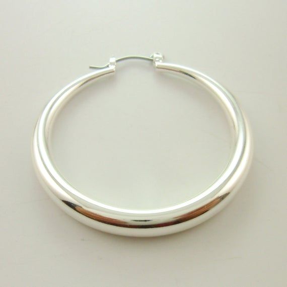 They are handmade large round chic bold hoops. Use high quality brass lead nickel chromium free and genuine silver plated over brass. DETAILS:- 41mm wide of the hoop. 4.5mm thick (the thickest part)- Genuine silver, brass.- 2pcs (one pair)PRODUCT CARE:- Please avoid contact with liquids and perfumes.CUSTOM:- If you have your styles, please feel free to contact. We are factory and offer you low price. Polished Metal Round Hoop Earrings, Arrow Ring, Classic Chic, Personalized Initials, Silver Hoops, Limited Stock, Silver Hoop Earrings, Adjustable Rings, Low Price