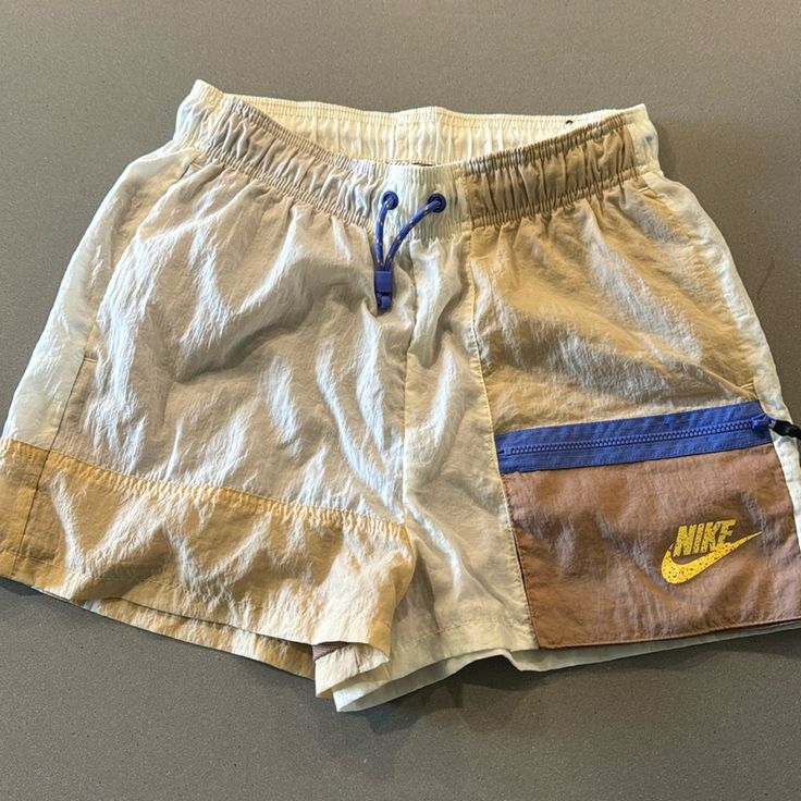 Never Worn. New Condition Nike Summer Bottoms For Vacation, Nike Summer Vacation Bottoms, Sporty Nike Bottoms For Vacation, Sporty Neutral Bottoms For Spring, Sporty Brown Shorts For Spring, Nike Casual Vacation Bottoms, Sporty Khaki Shorts For Spring, Sporty Brown Bottoms For Spring, Nike Casual Beige Bottoms