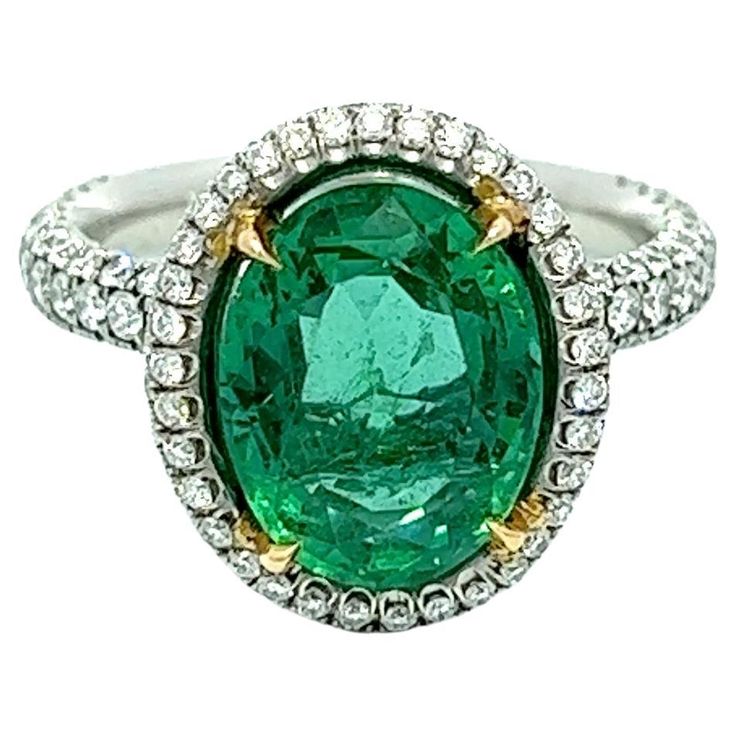 This exquisite ring boasts a 4.91-carat oval-shaped Colombian emerald, elegantly encircled by round diamonds that gradually taper down halfway on both sides. The emerald is set in platinum, ensuring maximum security and stability. You can rest assured of its top-notch quality and authenticity as it is GIA certified. This ring is bound to capture attention and make a bold fashion statement wherever you go. In Dept Description Emerald: 3.61CT Total Weight, Color Green, Oval Shape Diamonds: 1.36CT Emerald And Diamond Ring, Emerald Diamond Ring, Green Oval, Colombian Emeralds, Sea Waves, Royal Jewelry, Emerald Diamond, Bold Fashion, Cocktail Rings