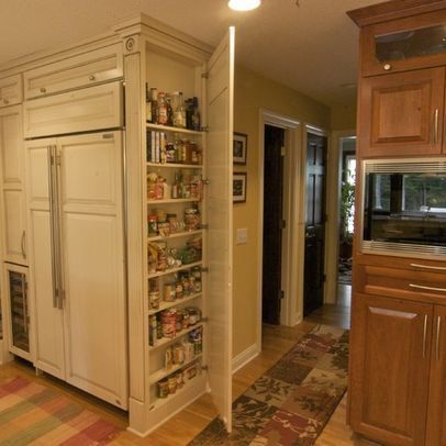 an open pantry in the middle of a kitchen