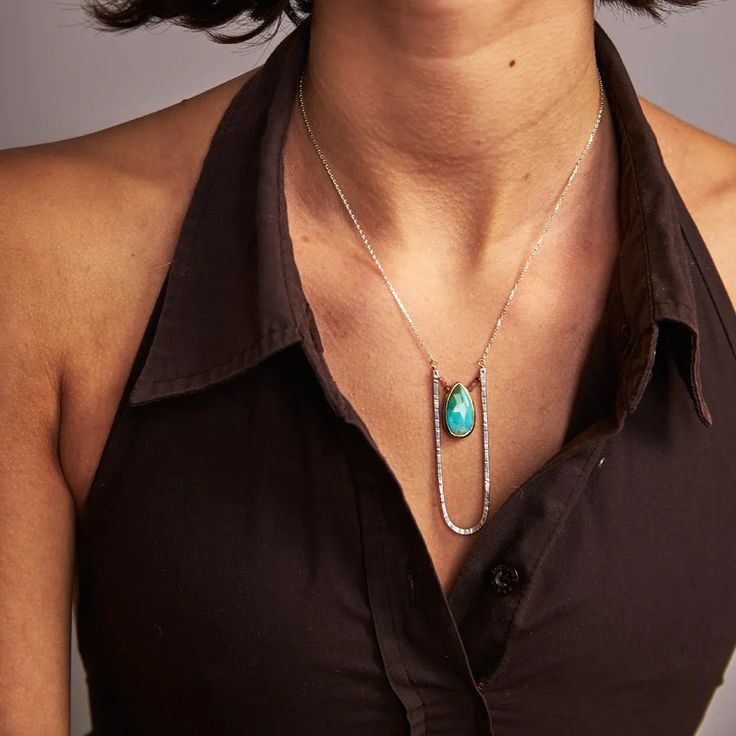 A large sterling silver pendant is forged by hand with reflective texture, surrounding a beautiful blue and pink combination of gorgeous turquoise and tiny faceted tourmaline gemstones. From our Wanderlust Collection. #handforged #eclecticstyle #statementjewelry •Sterling silver •Turquoise and tourmaline �•Pendant Dimensions: 3/4 x 2.25" •Necklace length: 17" Blue And Pink Combination, Pink Combination, Tourmaline Pendant, Tourmaline Gemstone, Eclectic Style, Wire Earrings, Turquoise Pendant, Blue And Pink, Summer Jewelry