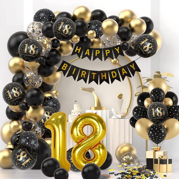 black and gold birthday decorations with balloons