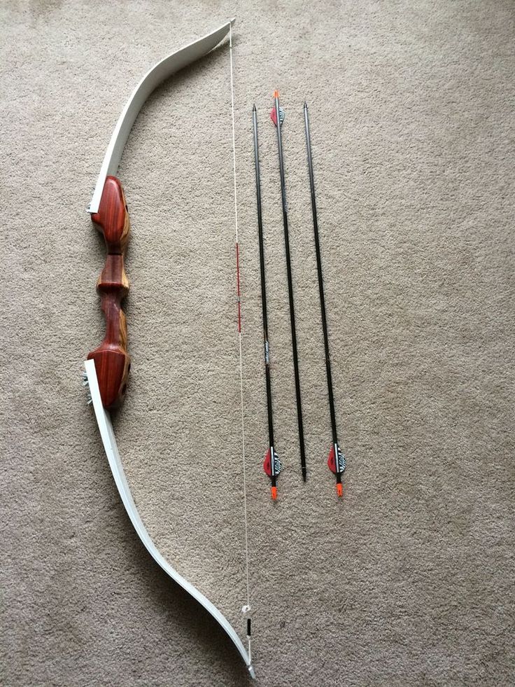 the bow and arrows are lying on the floor next to eachother's arrow