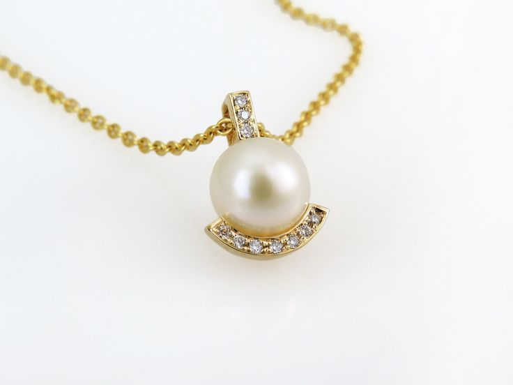 "This unique necklace is made of solid gold, set with high-quality diamonds that add extra sparkle, and a perfect round natural pearl. It is classic and elegant, made to upgrade every outfit with style. Get this unique art deco necklace for your beloved wife, mother, sister, daughter - or for yourself - to wear with any outfit and feel feminine and adorned! ✿ Item details ✿ ✿ Materials: - A natural 7 mm Pearl - 10 white diamonds of 0.04 CT; Color: F, Clarity: VS. - 14k // 18k White//Yellow/Rose Elegant Yellow Gold Pearl Necklace For Formal Occasions, Elegant Diamond Necklace With Pearl Chain For Formal Events, Elegant Formal Diamond Necklace With Pearl Chain, Elegant Diamond Necklace With Pearl Chain For Wedding, Formal Diamond Necklace With Pearl Drop, Elegant Pearl Chain Diamond Necklace For Anniversary, Elegant Diamond Pearl Chain Necklace For Anniversary, Elegant Yellow Gold Pearl Necklace With Round Pendant, Timeless Gold Pearl Necklace With Diamonds