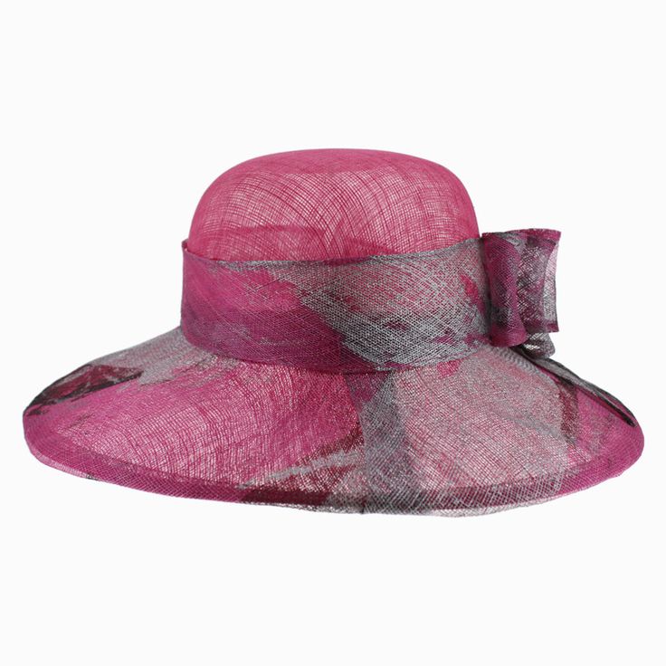 Designed by Complit Hats of Italy, the Belfry Via is an exquisite wide brim dress hat that features a hand-painted brim with bold splashes of silver and black artfully layered onto its soft cyclamen-colored body. The sinamay hat band is finished with a hand-painted triple layered bow. The brim offers a covered wired edge to maintain its classic shape and the interior has an adjustable drawstring that can be tightened for a better fit. FEATURESStyle: Wide Brim Dress HatMaterial: SinamayDimensions Elegant Adjustable Pink Fedora, Elegant Pink Adjustable Fedora, Elegant Pink Wide Brim Fedora, Multicolor Brimmed Cloche Hat, Summer Wide Brim Sinamay Hat, Elegant Pink Brimmed Fedora, Spring Evening Cloche Hat With Flat Brim, Summer Flat Brim Sinamay Hat, Summer Sinamay Hat With Flat Brim