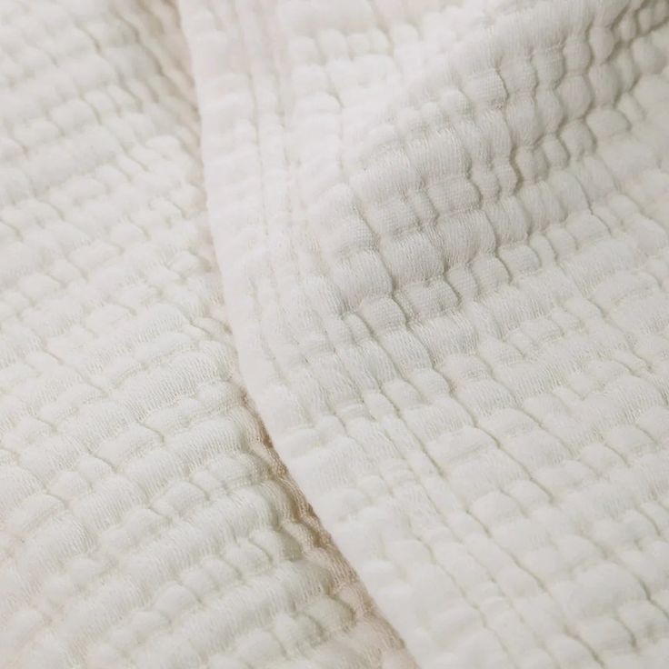 closeup of the texture of a white blanket