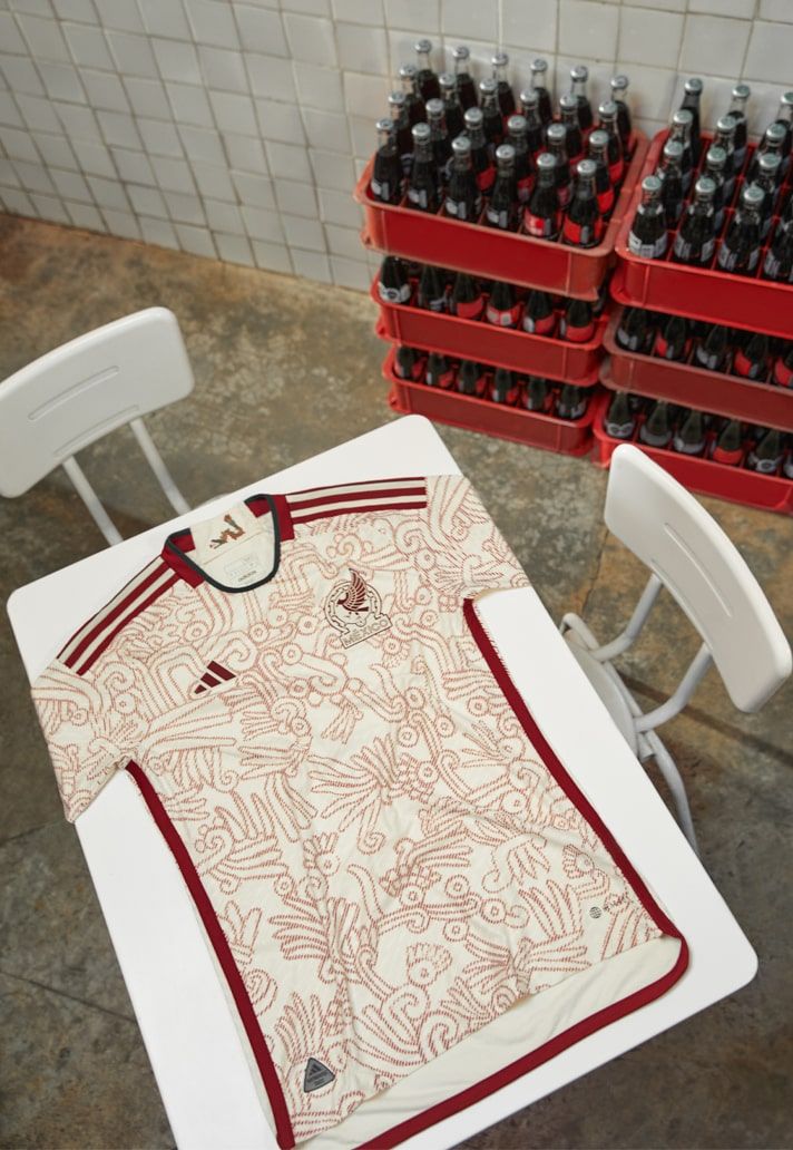 a table with a shirt on it next to many bottles of beer in the background