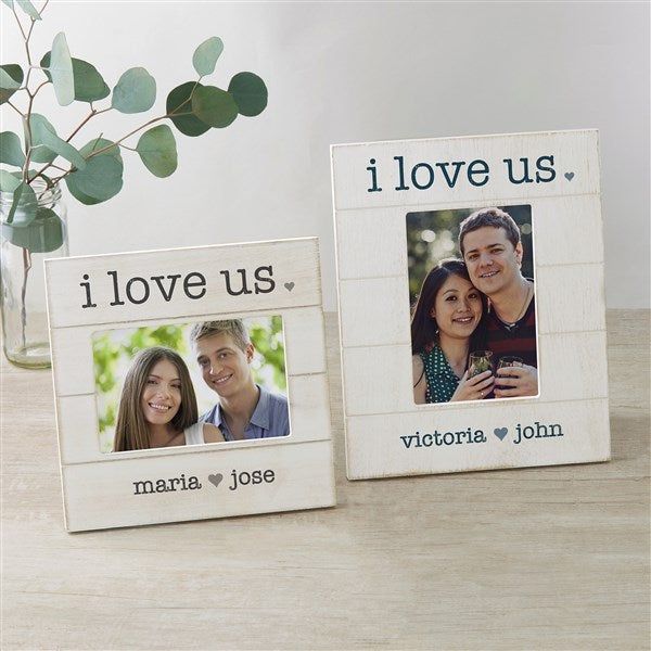 two wooden frames with the words i love us, i love us and an image of a man and woman