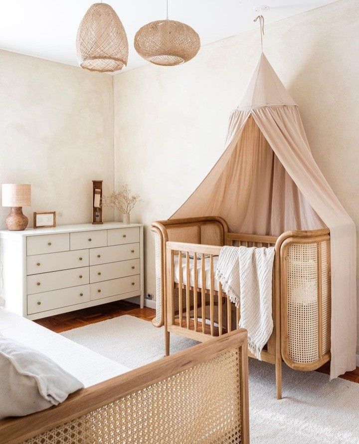 a baby's room with a crib, dresser and bed