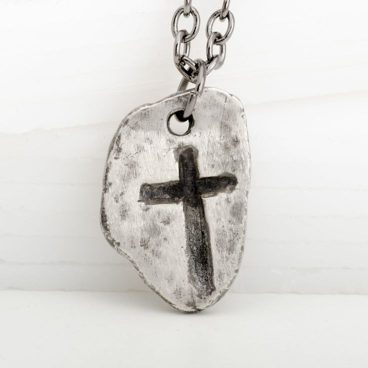 This Medieval Cross Gothic Guitar Pick Pendant is the perfect jewelry piece for any fun-loving rocker. Expertly crafted from 925 sterling silver, it will have you looking, and feeling, like a true Medieval lord! With its dark patina for a vintage look, this piece gives off an old-school vintage vibe - perfect for reminding you to rock on! Antique Silver Hand Cast Sterling Silver Necklace, Medieval Hand Forged Sterling Silver Jewelry, Hand Cast Antique Silver Sterling Silver Necklace, Symbolic Hand Cast Sterling Silver Necklaces, Hand Cast Sterling Silver Necklace In Antique Silver, Symbolic Hand Cast Sterling Silver Necklace, Bohemian Hand Cast Sterling Silver Necklace, Symbolic Sterling Silver Necklace, Memorial Sterling Silver Jewelry With Oxidized Finish