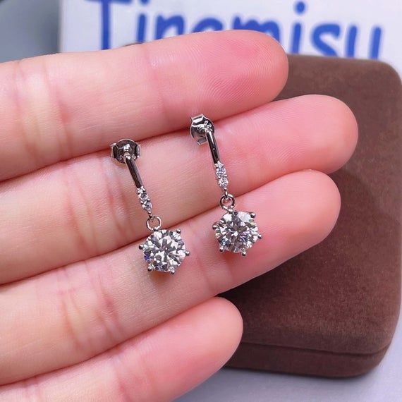 ❤ Moissanite Earring Information ❀It is 100% handmade.❀It is cut and polished by professional craftsman.❀Center Stone is a delicate round moissanite. ❤ Moissanite Details❀ Stone Weight: 1 ct❀ Measurement: 6.5 mm ❀ Stone Clarity: VVS1❀ Stone Shape: Round Cut❀ Stone Color: D Colorless❀ Stone Make: Great Quality❀ Stone Setting: Prong Setting❀ Metal color Gold is made in 18K Gold plated sterling silver.❀ Metal color Rose gold in 18K Rose Gold plated sterling silver.❀ Metal color Silver in 18K White Silver Earrings Wedding, Dangle Earrings Wedding, Bridal Earrings Drop, Sterling Silver Drop Earrings, Moissanite Earrings, Diamond Anniversary Rings, Moissanite Jewelry, Jewelry Sterling Silver, Round Moissanite