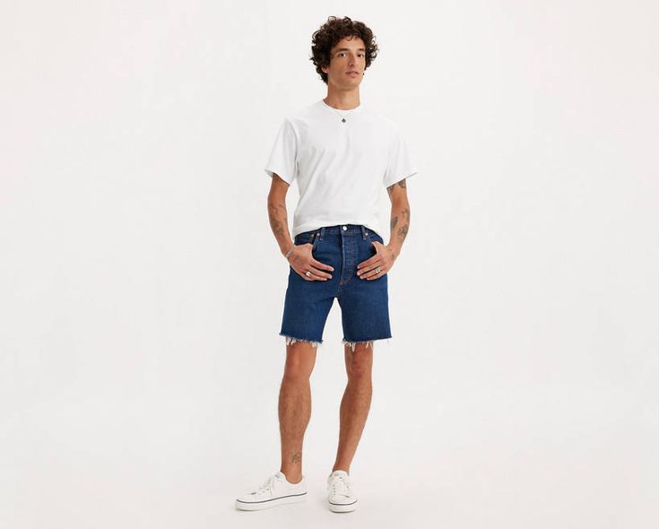 Nothing beats a pair of cut-offs when it's hot out. We took our vintage-inspired 501® ‘93 Straight jeans and reimagined them as these Cut-Off Shorts, so you don't have to do the work. You're welcome. Straight fitting cut-off shorts Classic '90s look and feel Crafted with non-stretch denim That perfect broken-in look;without putting in the work. This garment was distressed for an authentic vintage-inspired feel and lived-in style. Hold the H2O: This garment was made using recycled water, which he Live In Style, 90s Looks, Do The Work, Cut Offs, Levi's 501, It's Hot, Cut Off Shorts, Men's Shorts, Cut Off