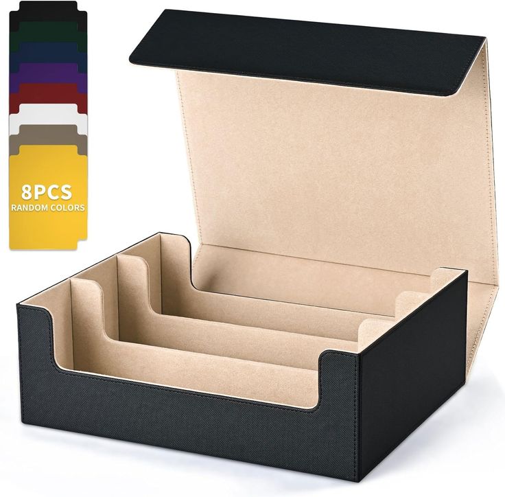 an open black box with compartments for pens and pencils on white background next to color swatches