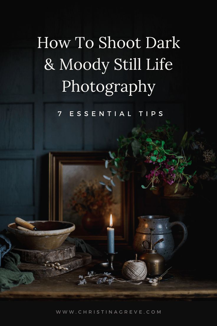 a table with a candle, potted plant and other items on it that says how to shoot dark & moody still life photography