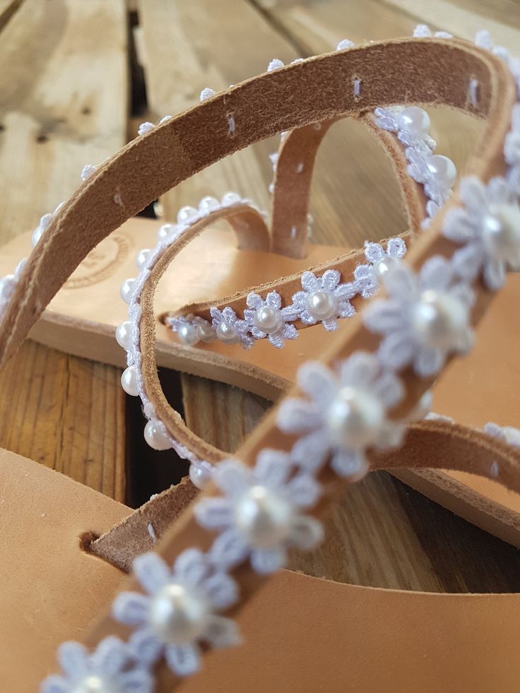 SHIPPING via DHL EXPRESS WORLDWIDE: 1 - 4 business days delivery (Please fill in your phone number if you choose Express Shipping) ★ More wedding sandals and shoes: See my store: https://www.etsy.com/shop/PelinoSandals 💓 Handmade genuine Greek leather wedding sandals decorated with romantic lace or crystals,pearls,rhinestones ( all the embellishments are hand sewn onto the leather straps) for brides dreaming of a beach wedding, a Bachelor party or even a city wedding. I am here to create with y Spring Wedding Beaded Sandals, Pearl White Summer Wedding Shoes, Elegant Handmade Beach Sandals, Summer Open Toe Pearl Wedding Shoes, Summer Wedding Pearl Open Toe Shoes, Elegant White Beaded Sandals, Beaded Open Toe Sandals For Wedding, White Beaded Sandals For Wedding, White Beaded Wedding Sandals