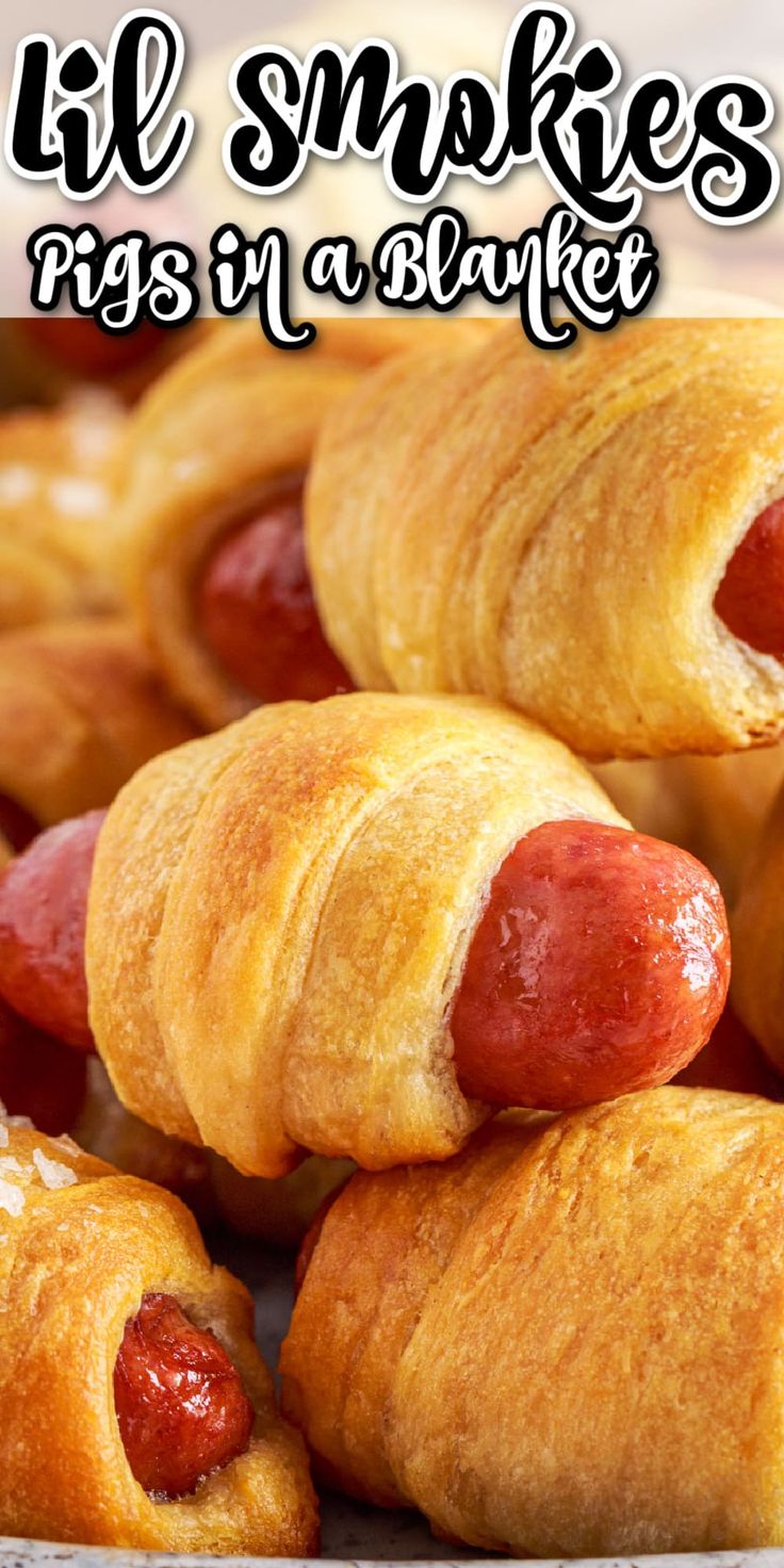 there are some hotdogs wrapped in a blanket on the plate with text overlay that reads, lil smokies pigs in a blanket