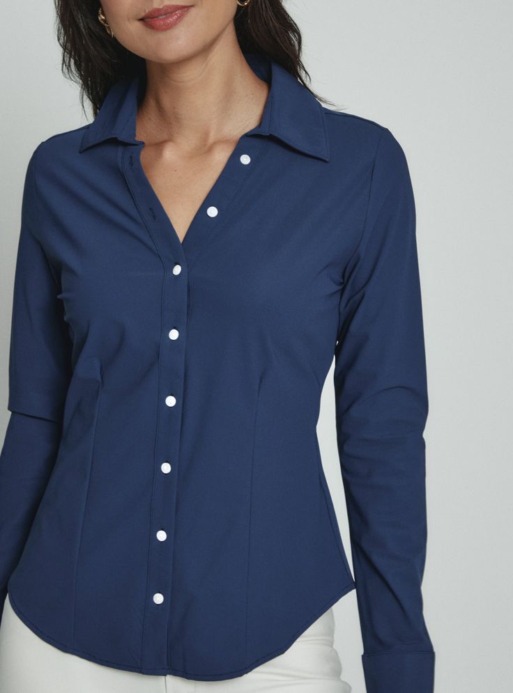 The Luxe Blouse features 4-Way Stretch fabrication that is both moisture-wicking and wrinkle free. This is a flattering semi-fitted blouse designed with mother of pearl buttons for a sophisticated look. Perfect for the office or a fancy dinner on the weekend. Details Model is 5'10" and wears a size small. Care: Machine wash cold on delicate cycle with similar colors. Do not bleach. Dry flat. Do not dry clean. Cold hand wash for best results. Composition: 78% Nylon | 22% Spandex Blouse Designed, Fitted Blouse, Wear Red, Fancy Dinner, Red Pants, Nylon Fabric, Wearing Red, Mother Of Pearl Buttons, Pearl Buttons