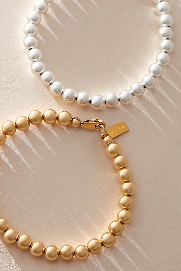 The *perfect* minimal bracelet, featuring a shiny metal finish and bold beaded design with lobster clasp closure. **Features:** Gold: 14k gold filled, silver: sterling silver, 6mm beads and findings, lobster clasp closure, 7" length **Why We ❤ It:** This beaded bracelet is a timeless addition to any wrist. | Set & Stones Cameron Bracelet at Free People in Silver Gold Sterling Silver Bracelet With Round Beads, Minimalist Single Strand Gold Bracelet, Gold Bracelet With Sterling Silver Clasp For Everyday, Gold Bracelets With Sterling Silver Clasp For Everyday, Elegant Sterling Silver Bracelet With Spacer Beads, Classic Single Strand Beaded Bracelets For Everyday, Modern Gold Bracelets With Sterling Silver Clasp, Elegant Beaded Bracelets With Sterling Silver Clasp, Elegant Beaded Bracelet With Sterling Silver Clasp