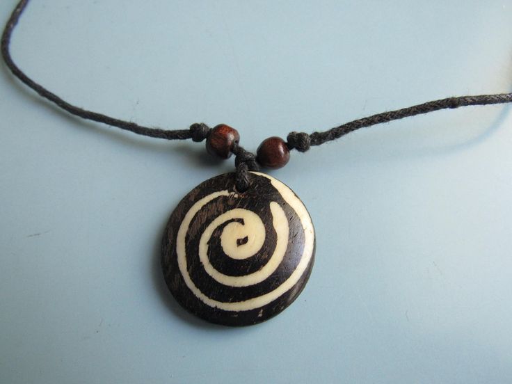 This vintage wooden tribal pendant necklace is in nice condition.  The pendant is about 1 1/4 inches tall and the necklace is about 28 inches long, but it is adjustable. Free domestic shipping. Pendant Necklaces, Halloween Shopping, Jewelry Necklace Pendant, Accessory Gift, Jewelry Necklaces, Gift Card, Electronic Accessories, Necklaces, Pendant Necklace