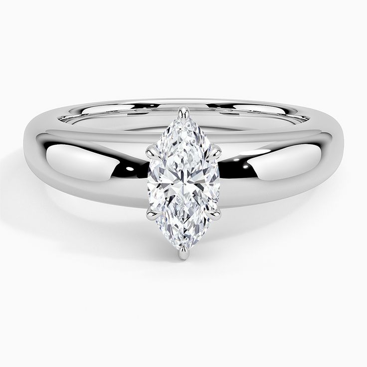 a white gold ring with a pear shaped diamond