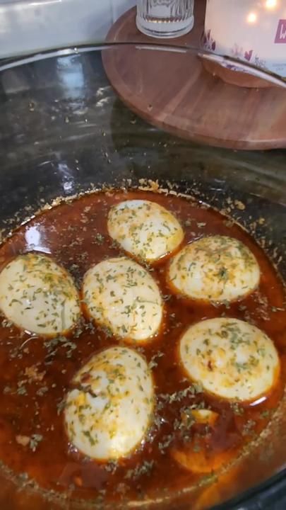 some food is cooking in a pan on the stove top and ready to be cooked