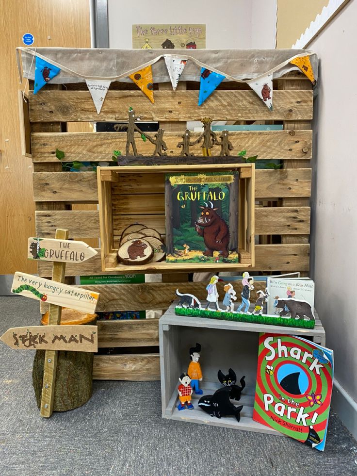 a wooden crate filled with books and toys