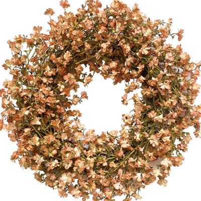 the wreath is made up of dried flowers