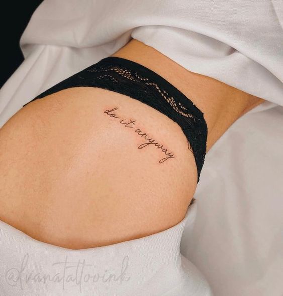 a woman with a tattoo on her stomach saying, love is always in the air