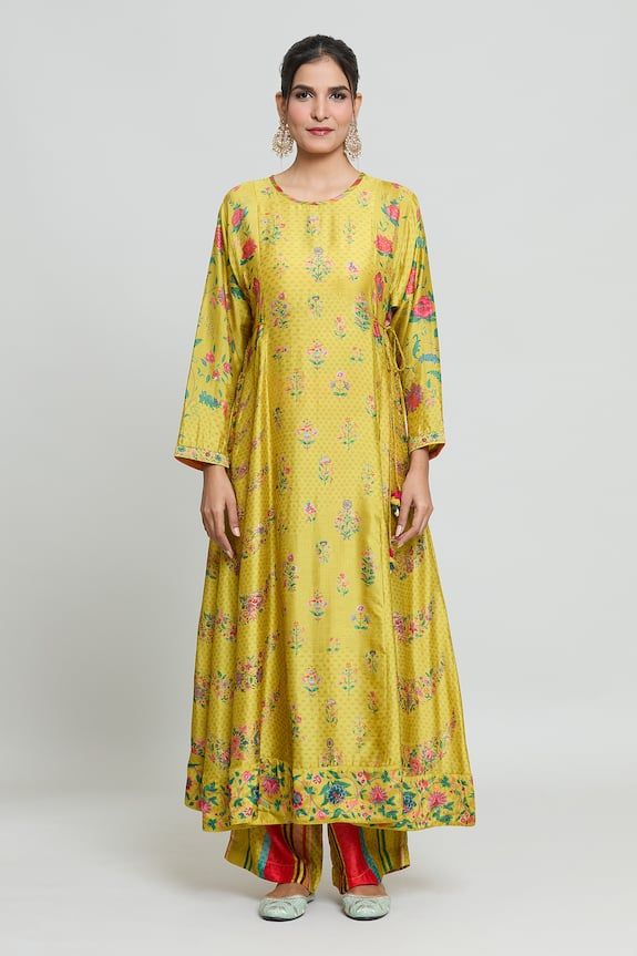 Mustard yellow kurta with floral print. Paired with a striped palazzo. - Aza Fashions Yellow Anarkali Palazzo Set With Printed Motifs, Yellow Silk Sets With Printed Motifs, Yellow Anarkali Kurta With Floral Print, Yellow Silk Sets With Floral Print, Yellow Silk Floral Print Sets, Yellow Floral Print Silk Sets, Yellow Silk Sets For Spring, Festive Yellow Kurta With Floral Print, Yellow Anarkali Palazzo Set For Spring