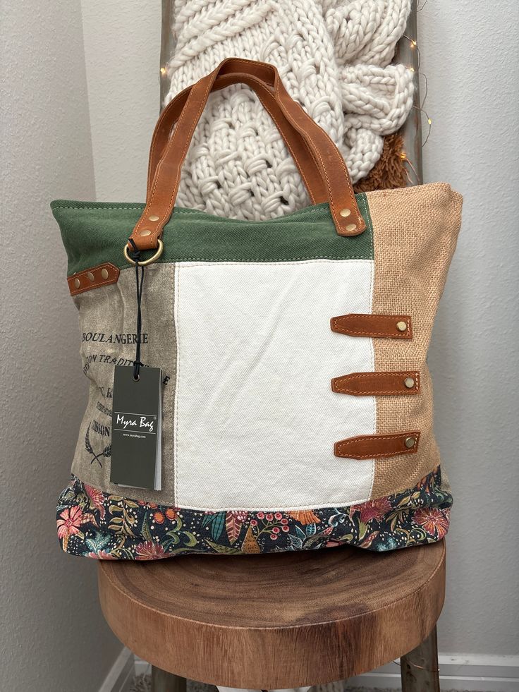 a purse sitting on top of a wooden stool